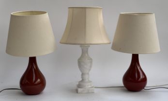 A pair of red glazed ceramic table lamps, approx. 36cmH to top of light fitting; together with a