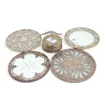 A set of 12 glass and sterling silver coasters, 7.5cmD; together with four larger