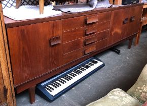 A mid century teak sideboard, four drawers, three cupboard doors, 214x46x74cmH