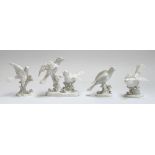 A collection of four Crown Staffordshire white glaze bird figurines, modelled by G.T Jones, two