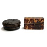 A circular pressed horn snuff box, 10cm diameter; together with a tortoiseshell oblong box, hinge in