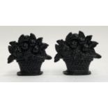 A pair of very small cast iron doorstops in the form of baskets of fruit, each 12cmH