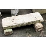 A heavy Portland stone slab bench (supports different heights)