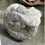 An impressively large ammonite fossil, approx. 44cm high, set with a house number