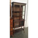 A 20th century mahogany and line inaid display cabinet, simulated marble frieze, with two sets of