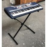 A Yamaha PSR-282 electric keyboard with stand