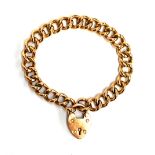 A 9ct gold curb link bracelet with padlock clasp, approx. 12.5g