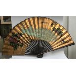 A very large decorative Chinese fan, painted with peacocks, 190cm wide