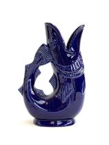 A Shreve, Crump & Low of Boston cobalt blue glazed 'Gurgling Cod Pitcher', made in the UK by