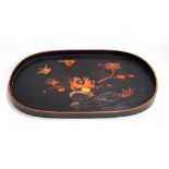 A large Japanese lacquered tray depicting birds amongst foliage, 74x46cm