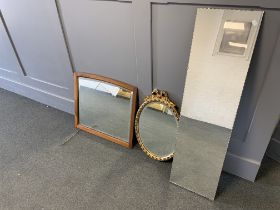 Three mirrors: one long mirror with shaped edge, 30.5x112cm; one framed with bevelled plate, 62.5x56