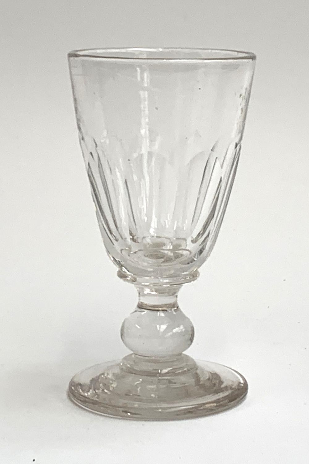A heavy Georgian wine glass, knopped stem on a slightly domed circular foot, 15.5cmH