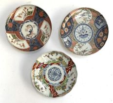 Three 20th century Imari plates, heightened in gilt, each approx. 22cmD (3)