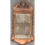 A 20th century walnut and gilt mirror in George II style, bevelled plate, 100x54cm