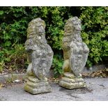 A pair of composite stone lion gate post finials, each approx. 85cm high