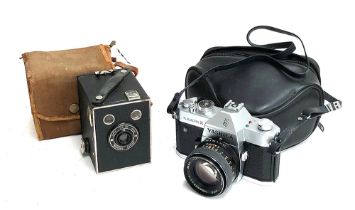 A Kodak Brownie Junior SIX-20 camera in canvas case; together with a Yashika TL Electro X 75mm