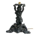 A patinated spelter table lamp in the form of a boy with a hunting horn, 22cmH