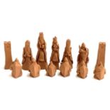 A number of handmade terracotta chess pieces, the tallest 14cmH