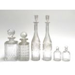 A pair of 19th century grape and vine bottle form decanters, 35cmH; a moulded glass decanter made in