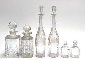 A pair of 19th century grape and vine bottle form decanters, 35cmH; a moulded glass decanter made in