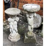 A composite stone birdbath in the form of a cherub, 84cmH, together with a composite stone statue of