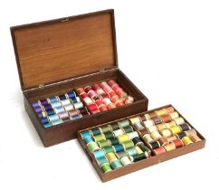 A pine sewing box with removeable tray, containing a large quantity of cotton reels, 38cmW