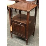 An early 20th century Howard & Sons bedside cabinet, with undershelf and single cupboard door, bears