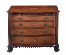 A George III style serpentine chest of drawers, having a slide over four graduating drawers each