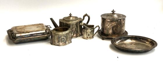 A lot of six silver plated items to include a teapot, serving dishes and a Walker & Hall biscuit