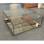A contemporary Tom Faulkner smoked glass and brass two tier coffee table, 110x110x42cmH