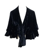 A vintage Woolland Bros black velvet capelet