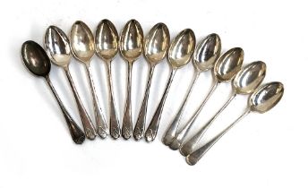 A set of six silver teaspoons, with crossed golf club terminals, Walker & Hall; together with a