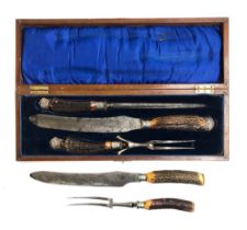 A mahogany cased steel and antler carving set by HJ Deacon, Swindon, with silver collars; together