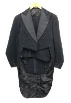 A set of Gieves black evening tails, c.1990, with corded black silk facings trousers with brace