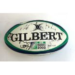 A 2003 Rugby World Cup match ball purportedly signed by the England National team, in Gilbert bag