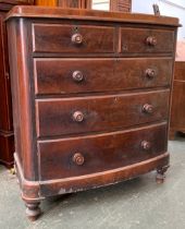 A large Victorian mahogany veneer bowfront chest of two short over three graduating drawers,
