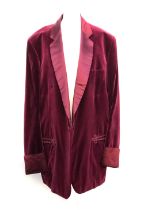 A Denman & Goddard single breasted dinner jacket, in maroon velvet, with turned cuffs and