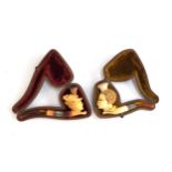 Two 19th century meerschaum pipes in fitted cases, one in the form of a lady in a bonnet, 11cmL;