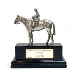 A cast silver trophy un the form of horse with jockety up, by Wakely & Wheeler, London 1983, the