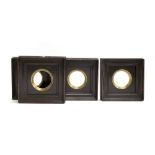 A set of four antiqued picture frames, circular gilt aperture 9cmD, 25cm square