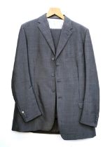 A Denman & Goddard gent's grey three piece suit, the trousers with button fly, side fastenings,