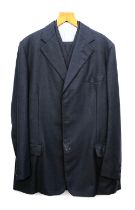 A Denman & Goddard single breasted charcoal grey wool suit c.1975, approx. 40" waist, 34" inside