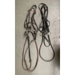 A full size snaffle exercise bridle; and a leather bridle (2)