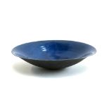 A deep blue studio pottery bowl, 42cm diameter, with mark to base