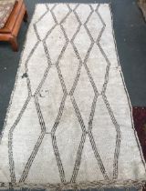 A large Morrocan Berber rug, 20th century, thick wool pile with traditional geometric design, (