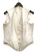 A ladies white wool hunt waistcoat, with Meath Hunt mother of pearl buttons, tailored by Roberts &