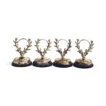 A set of four Edwardian silver place holders, modelled as stag's heads, by H V Pithey & Co,