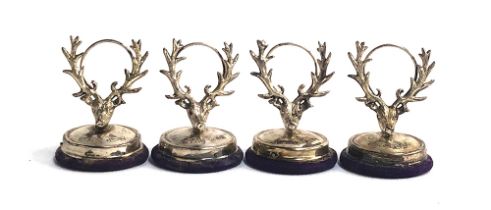 A set of four Edwardian silver place holders, modelled as stag's heads, by H V Pithey & Co,
