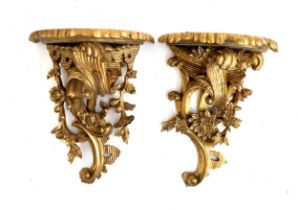 A pair of gilt painted carved wood wall brackets, each approx. 45cmL