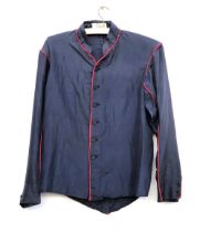 An early navy jockey's silk with red piping, made by Merry & Co, Saddlers St James Street London